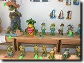 Frog collectibles outdoors and indoors.